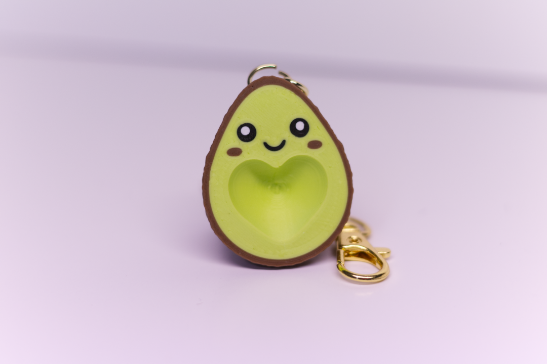 Half of the pair of the avocado key chain